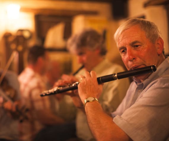 Traditional music enjoyed by Ireland tour guests in an Irish pub