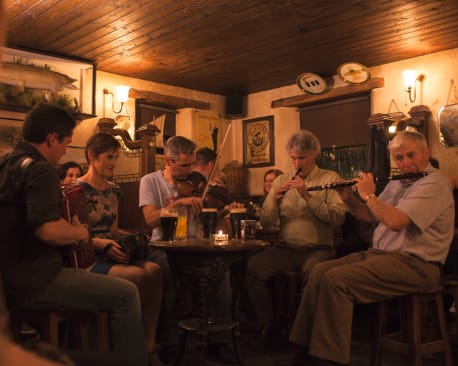 England and Ireland Tour guests enjoying a trad session in Ireland