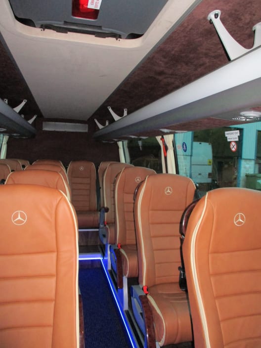 The exterior of our white 16 seater luxury mid sized coach