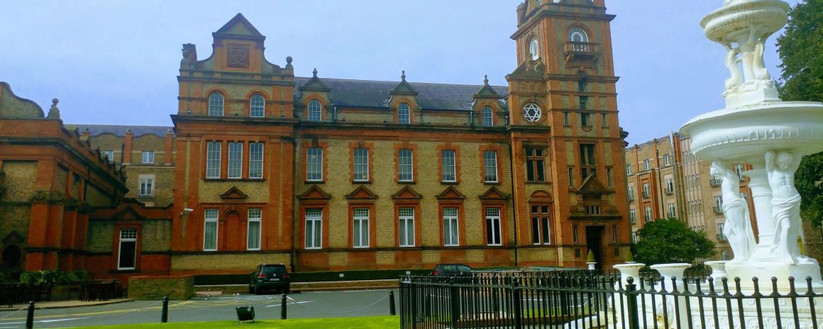 tours to scotland and ireland from usa An old redbrick building in Belfast city