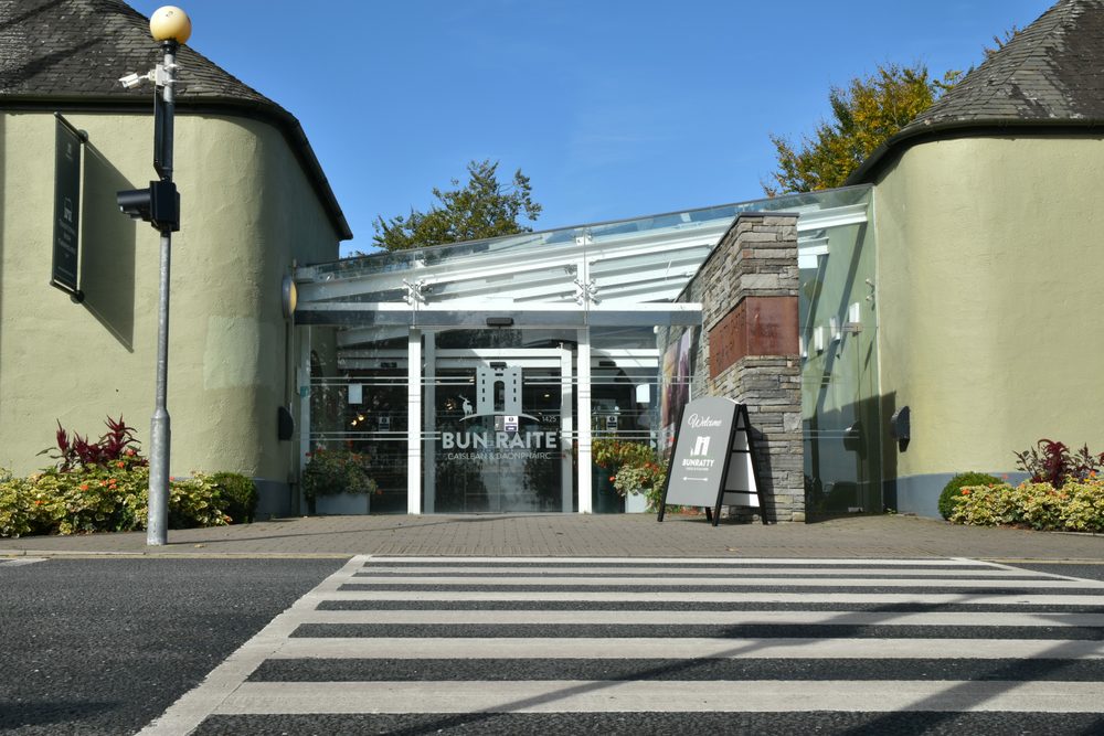 The main entrance to Bunratty Castle and Folk Park, seen across the zebra crossing by the car park