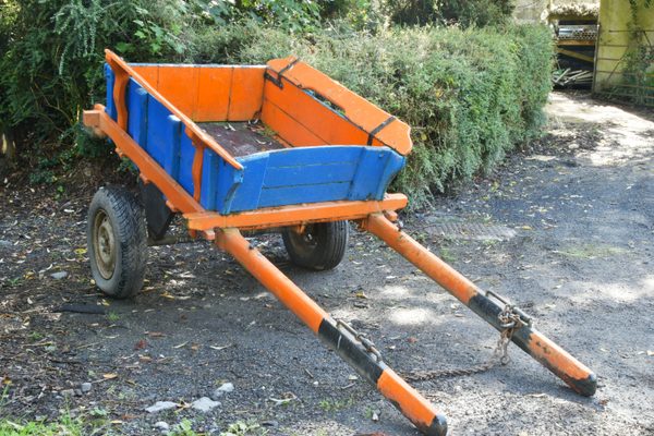 A wooden farm cart in the yard at Bunratty Folk Park