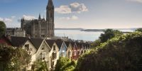 St Colmans Cathedral in Cobh with colourful houses on our boutique tour of Ireland.