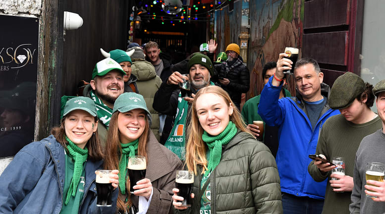 People celebrating a St Patrick's Day parade in Cork City, Ireland