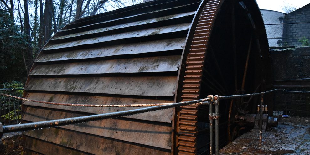 The great wooden water wheel at the Mill House, Midleton Distillery Experience