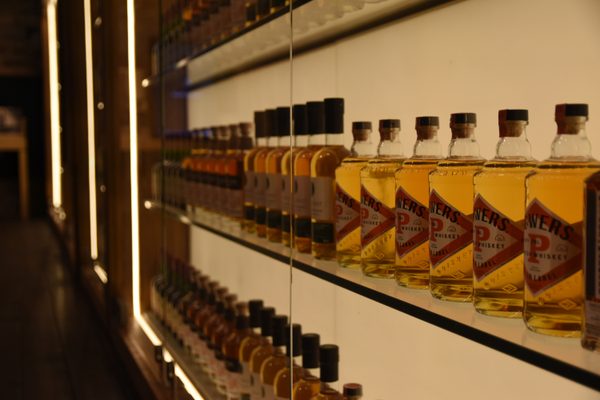 Shelves of whiskey bottles at Midleton Distillery Experience