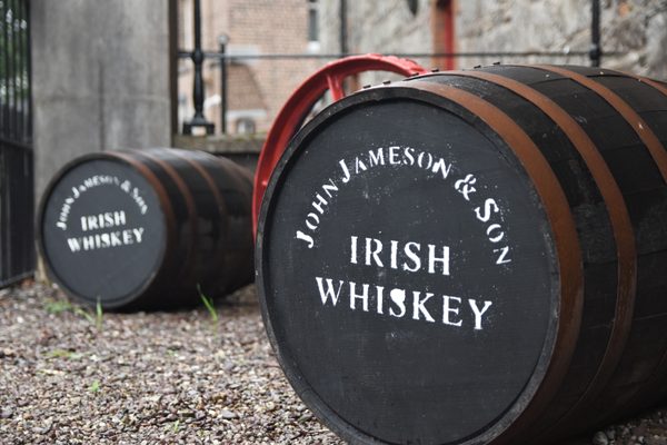 Fresh oak barrels waiting outside the historic distillery buildings