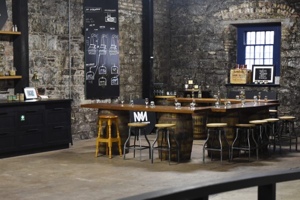 The rustic tasting bar at Midleton Distillery Experience, built on oak barrel bases