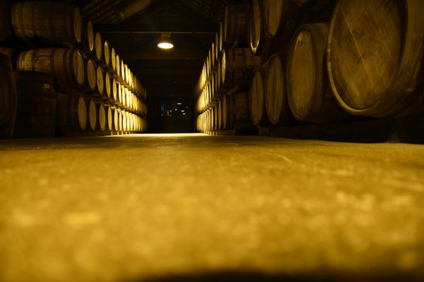 Rows of oak barrels in the maturation warehouse at Midleton Distillery Experience