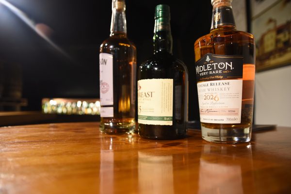 Whiskey bottles lined up on the bar