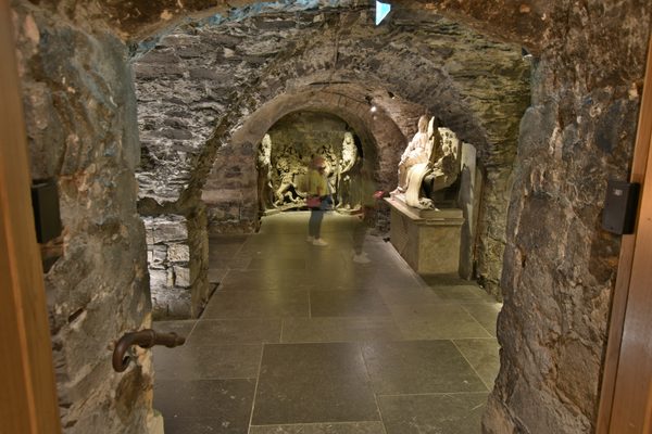 The bright, spacious stairwell and stone arches leading into the 12th-century crypt