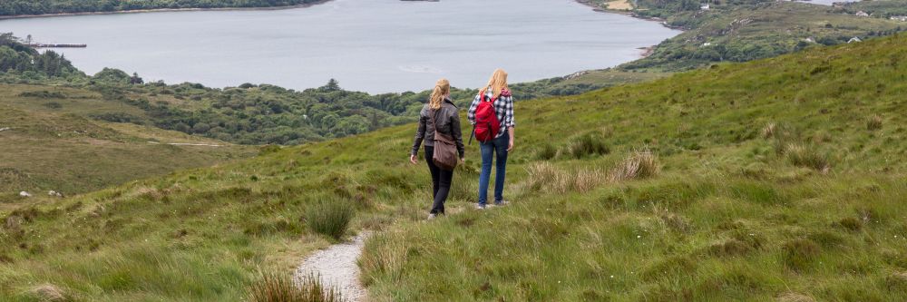 Girls backpacking through Connemara, Co. Galway, on the west coast of Ireland