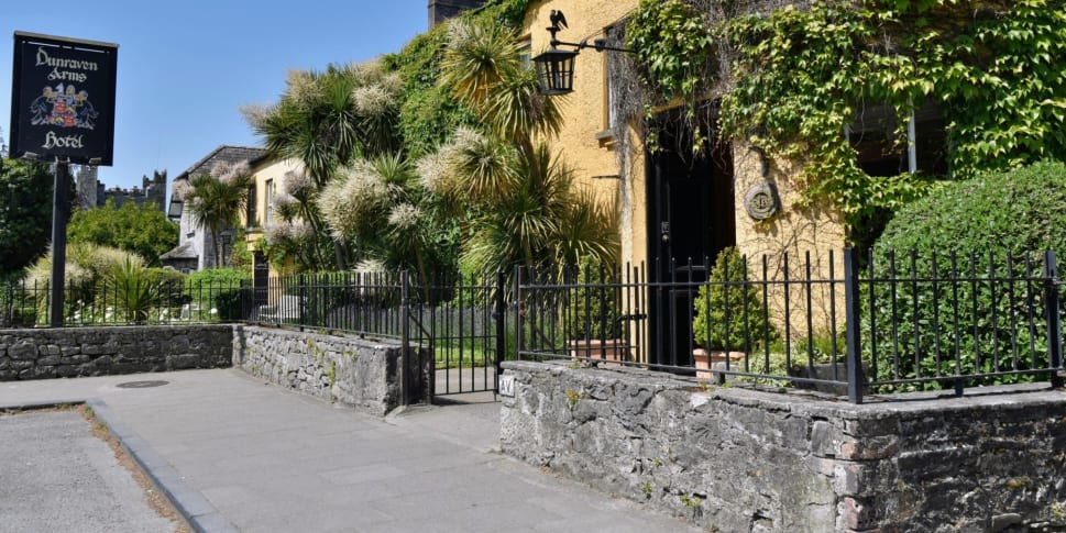 The historic Dunraven Arms Hotel, a bright yellow landmark in Adare village