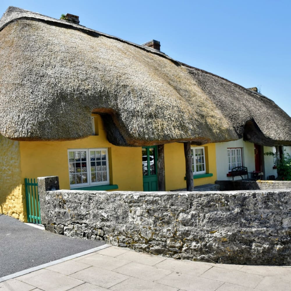 The famous thatched cottages lining the main street of Adare, County Limerick