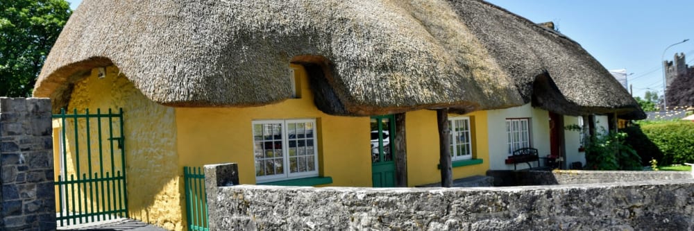 The famous thatched cottages lining the main street of Adare, County Limerick