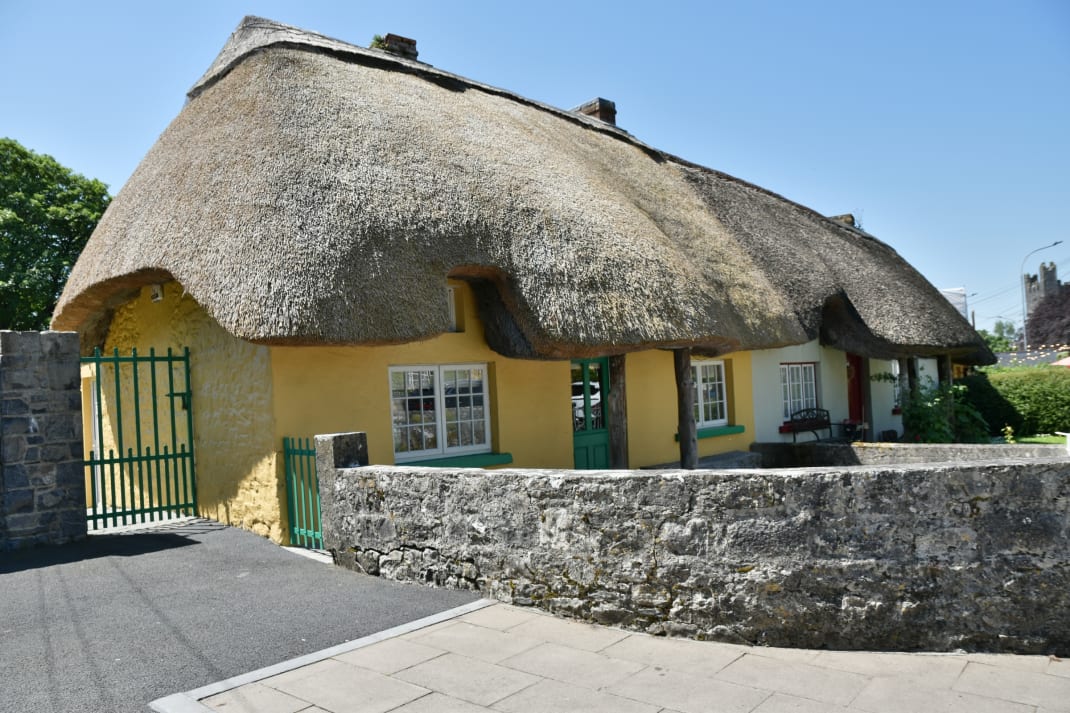 The thatched cottages lining the main street of Adare, County Limerick